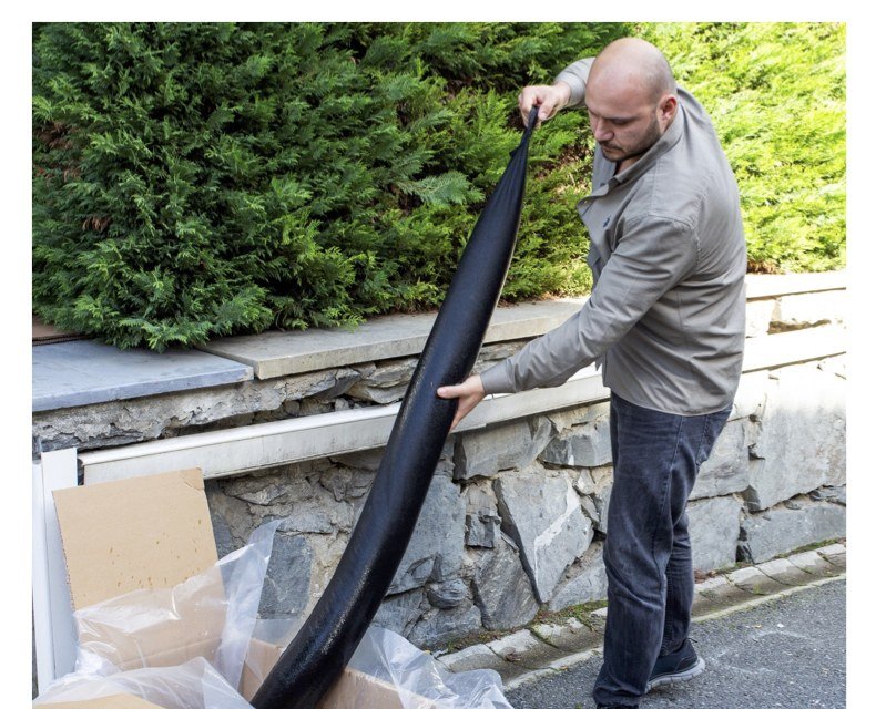 SUPER BLOC flood bag being carried by integrated handle